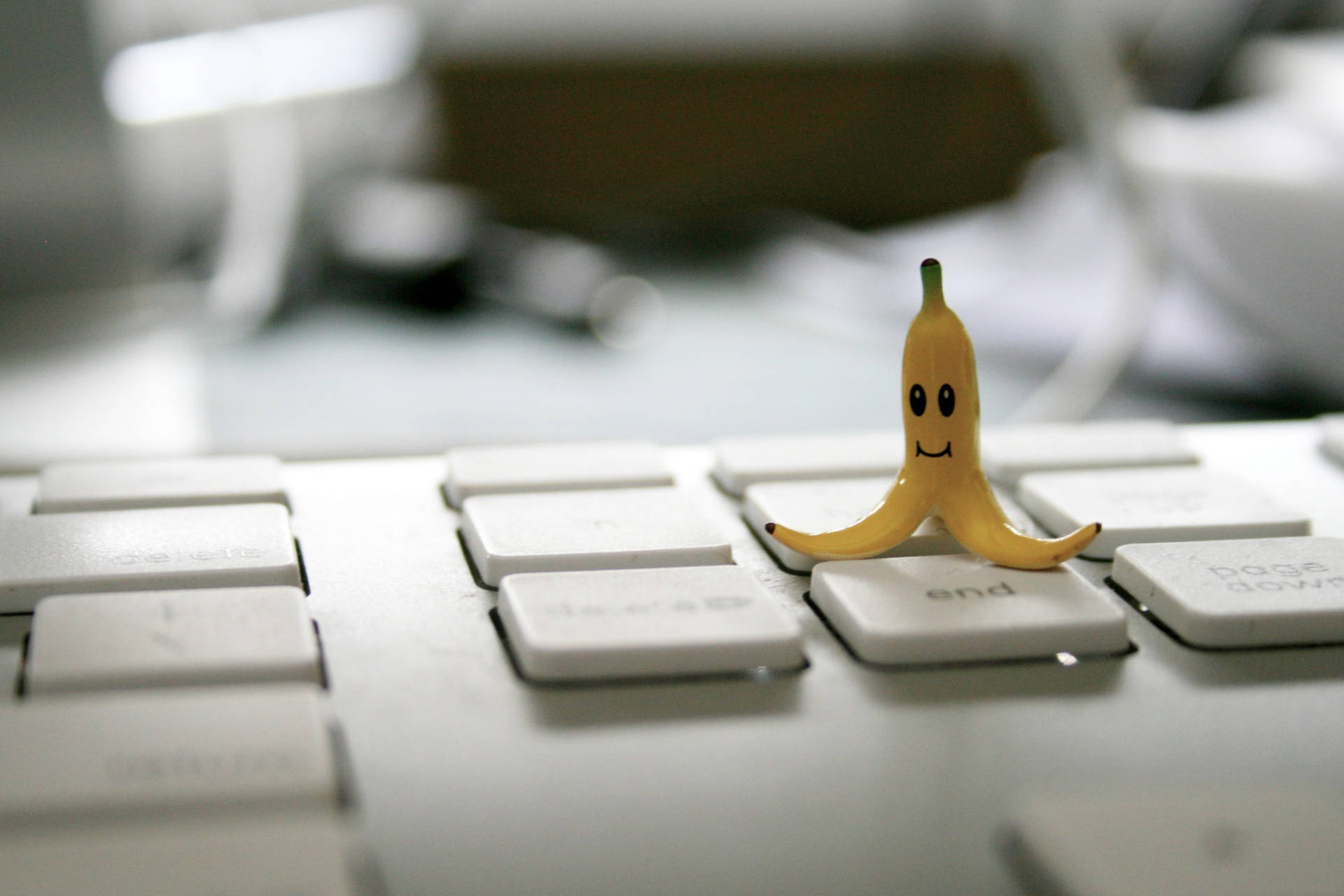 Cute Banana On Keyboard Background