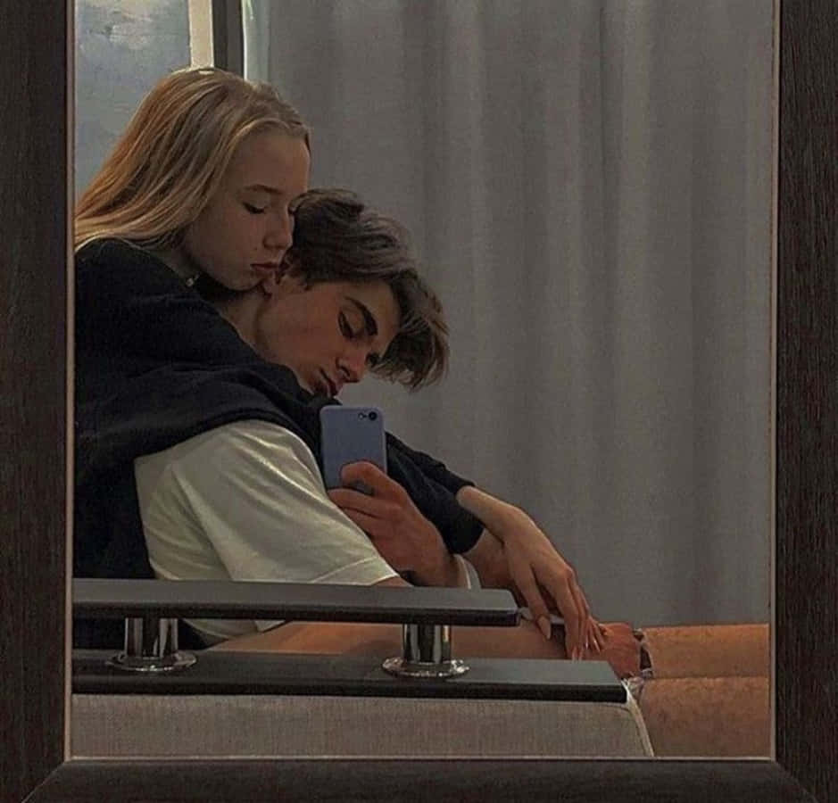 Cute Boyfriend Smiling And Embracing His Girlfriend Background