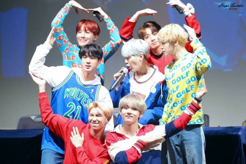 Cute Bts Group Does A Heart Pose Background