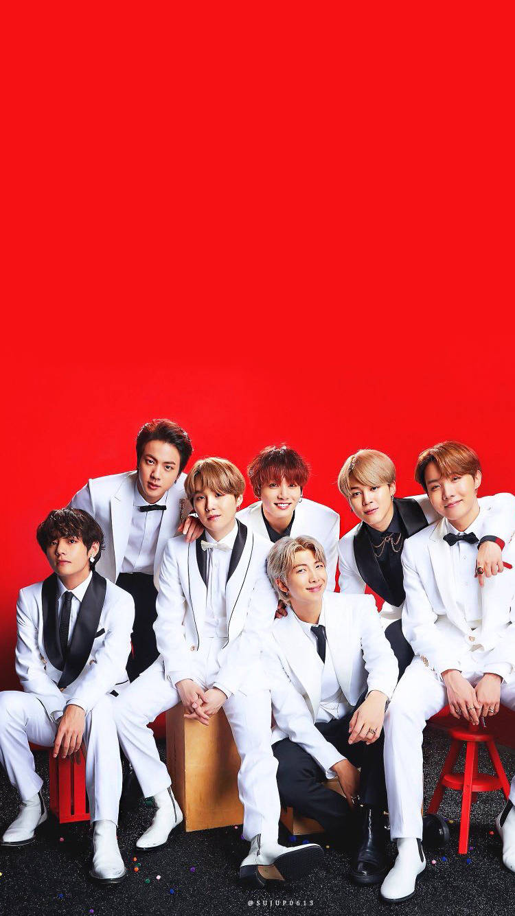 Cute Bts Group In Red Backdrop