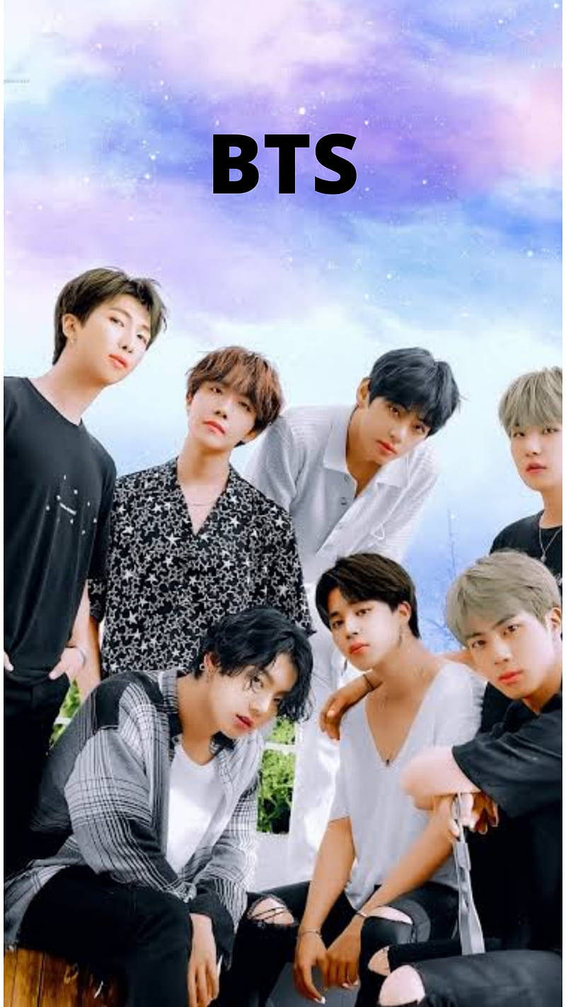 Cute Bts Group Posing With Pastel Sky Background