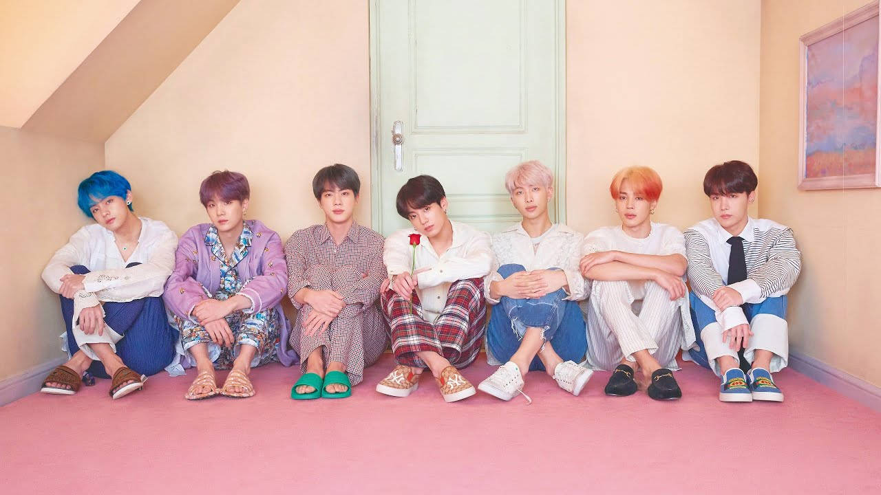 Cute Bts Group Sitting Together On The Attic Background