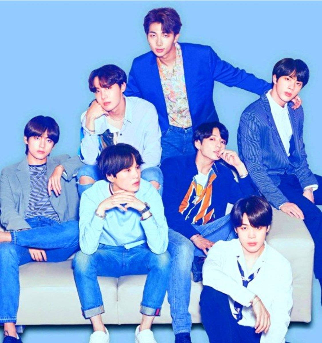 Cute Bts Group Wearing Different Shades Of Blue Background