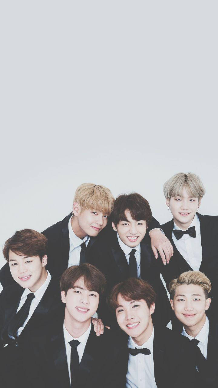 Cute Bts In Tuxedos Background