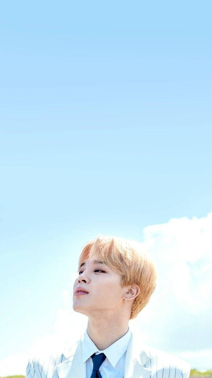 Cute Bts Jimin Under Sky Background