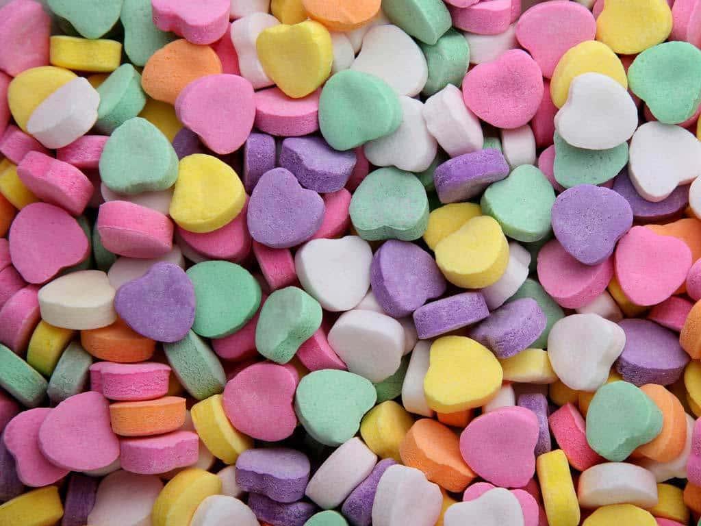 Cute Candies Heart Shapes Piled Together Background