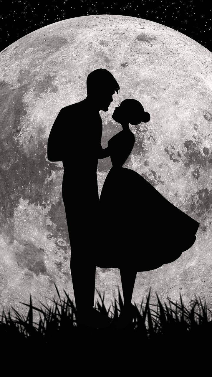 Cute Couple Silhouette In Front Of Moon Background