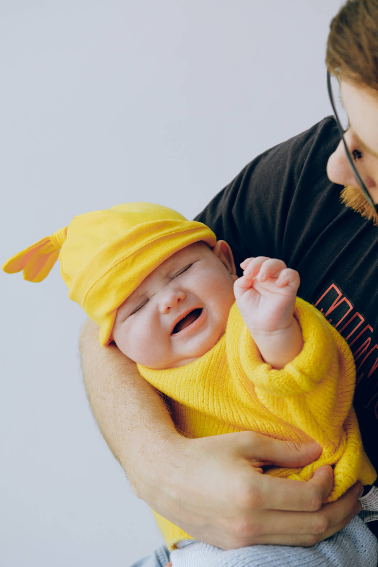 Cute Crying Baby In Yellow Outfit