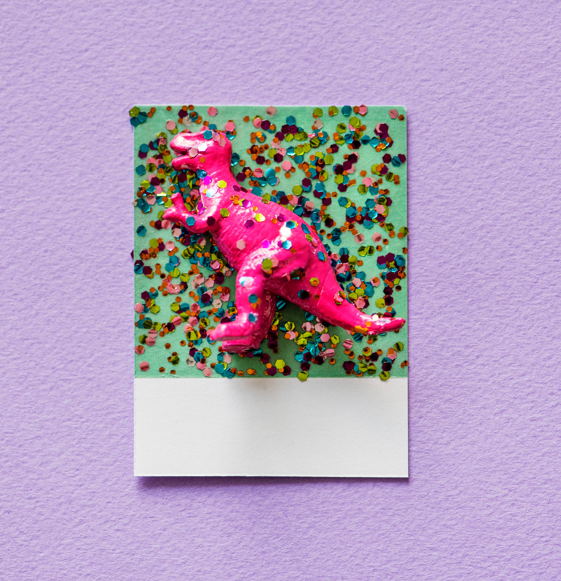Cute Dinosaur Toy With Confetti Background
