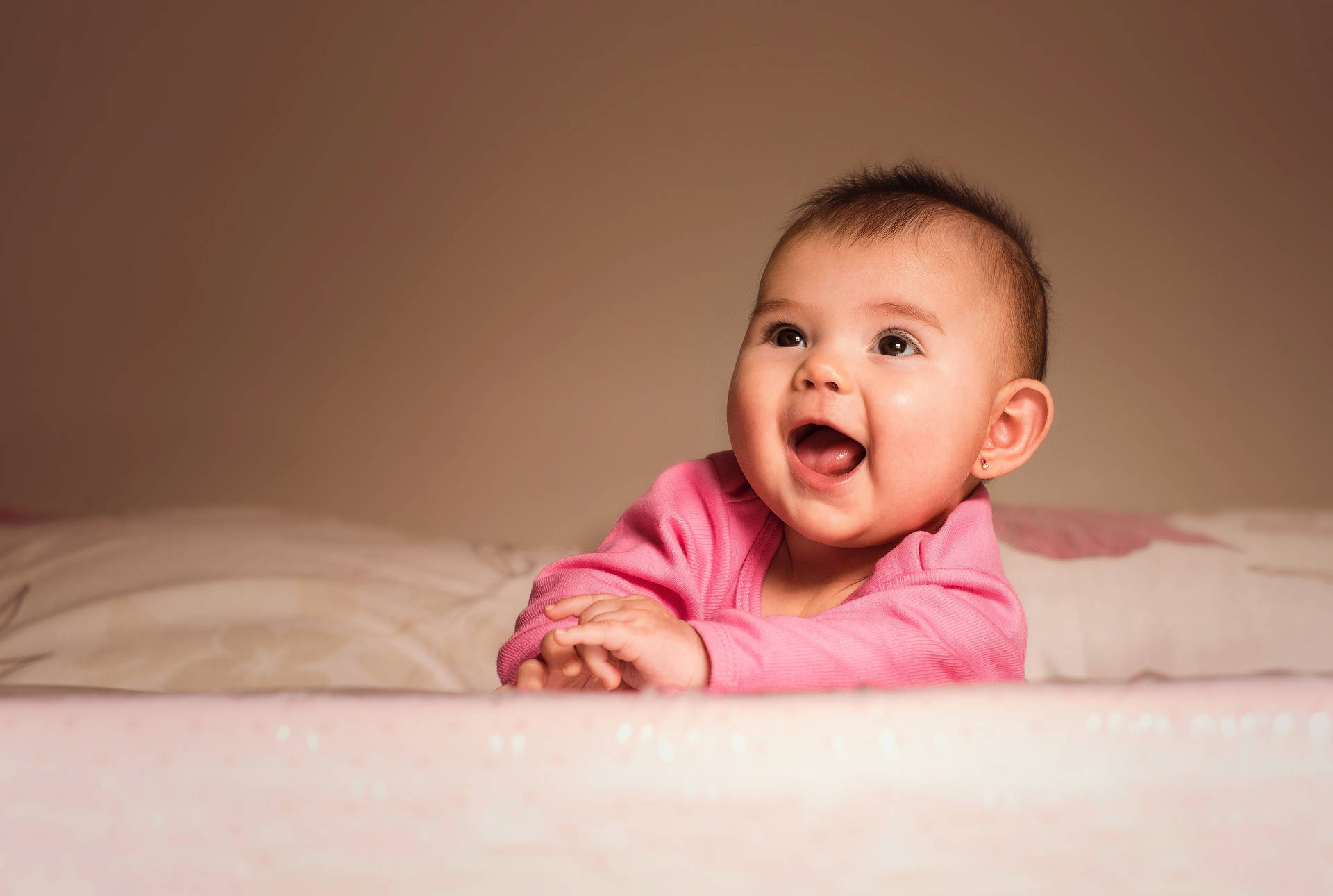 Cute Fun Baby In Pink Background