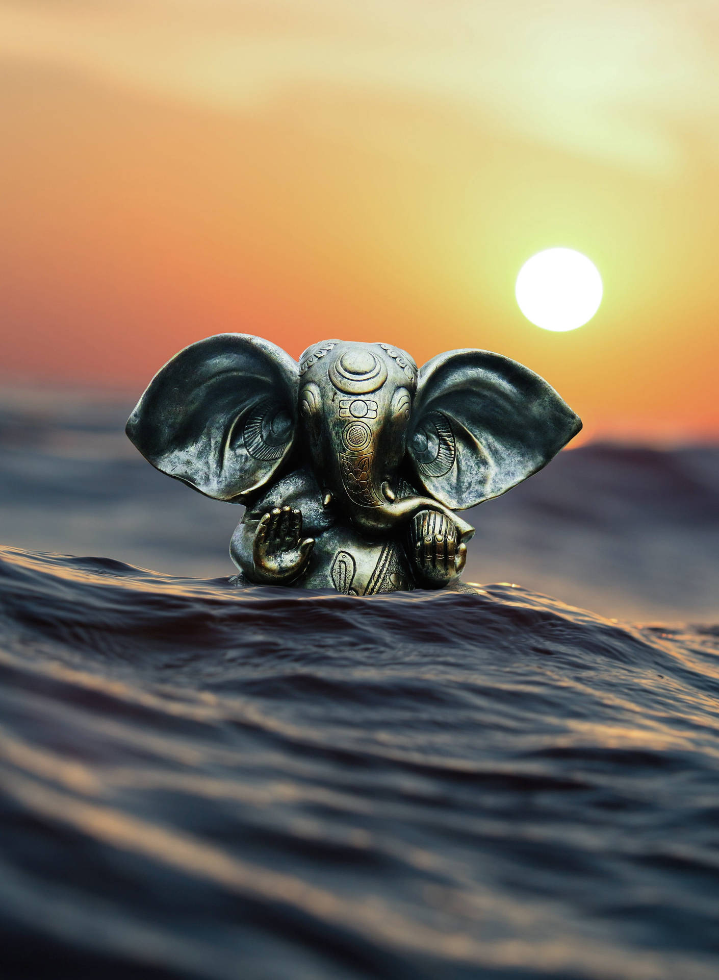 Cute Ganesha Silver Figurine On Ocean
