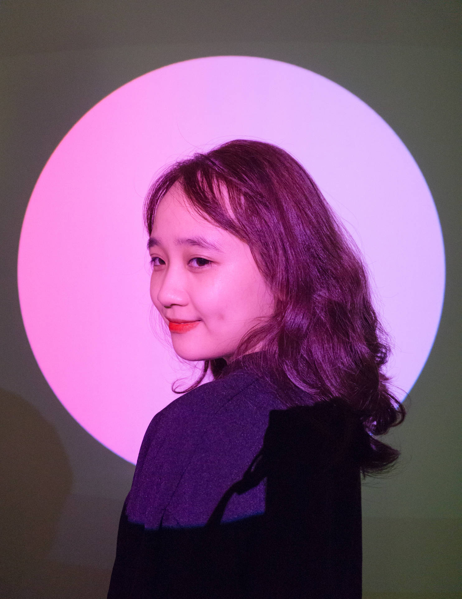 Cute Girl In Pink Light Background