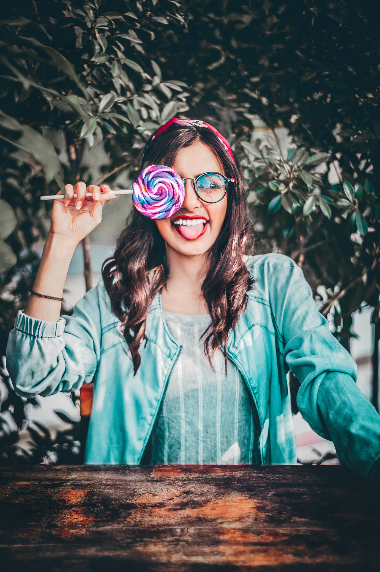 Cute Girl Wacky Pose With Lollipop Background