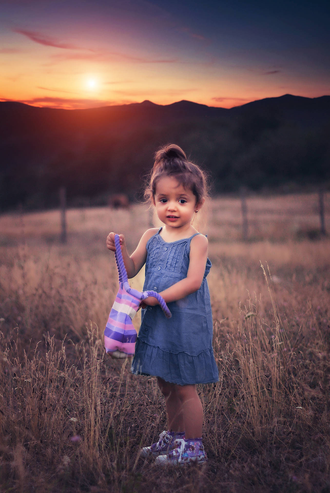 Cute Girl With Bag In Grass Field