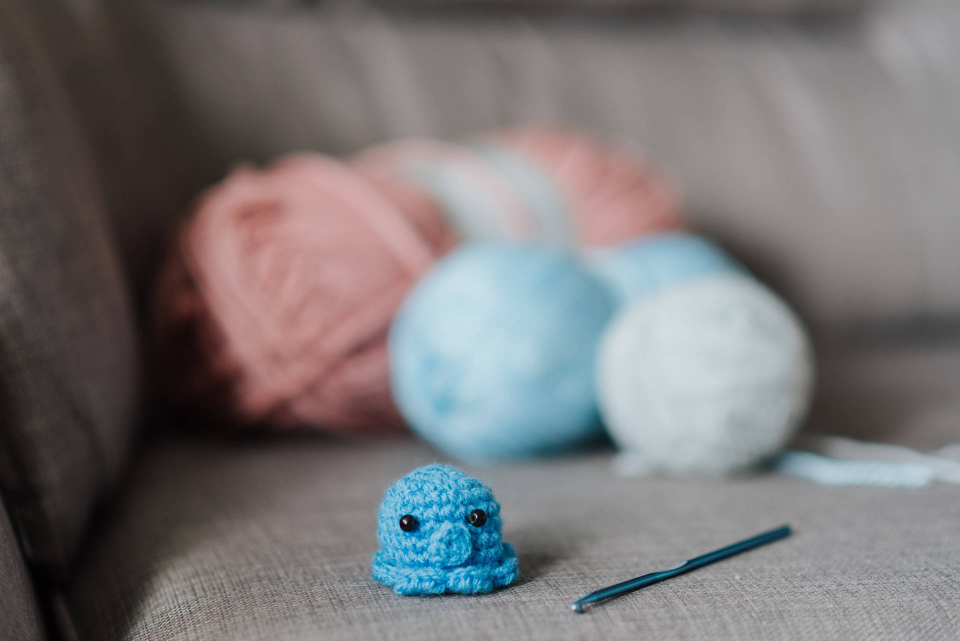 Cute Knitted Blue Octopus Background