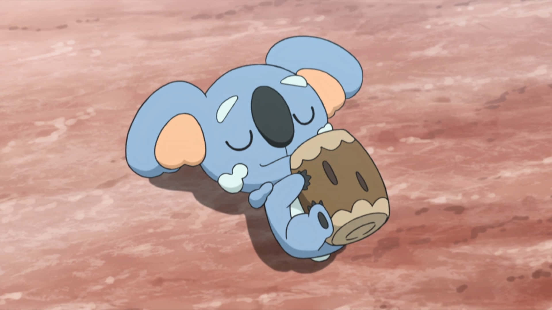 Cute Komala Lying On Ground Background