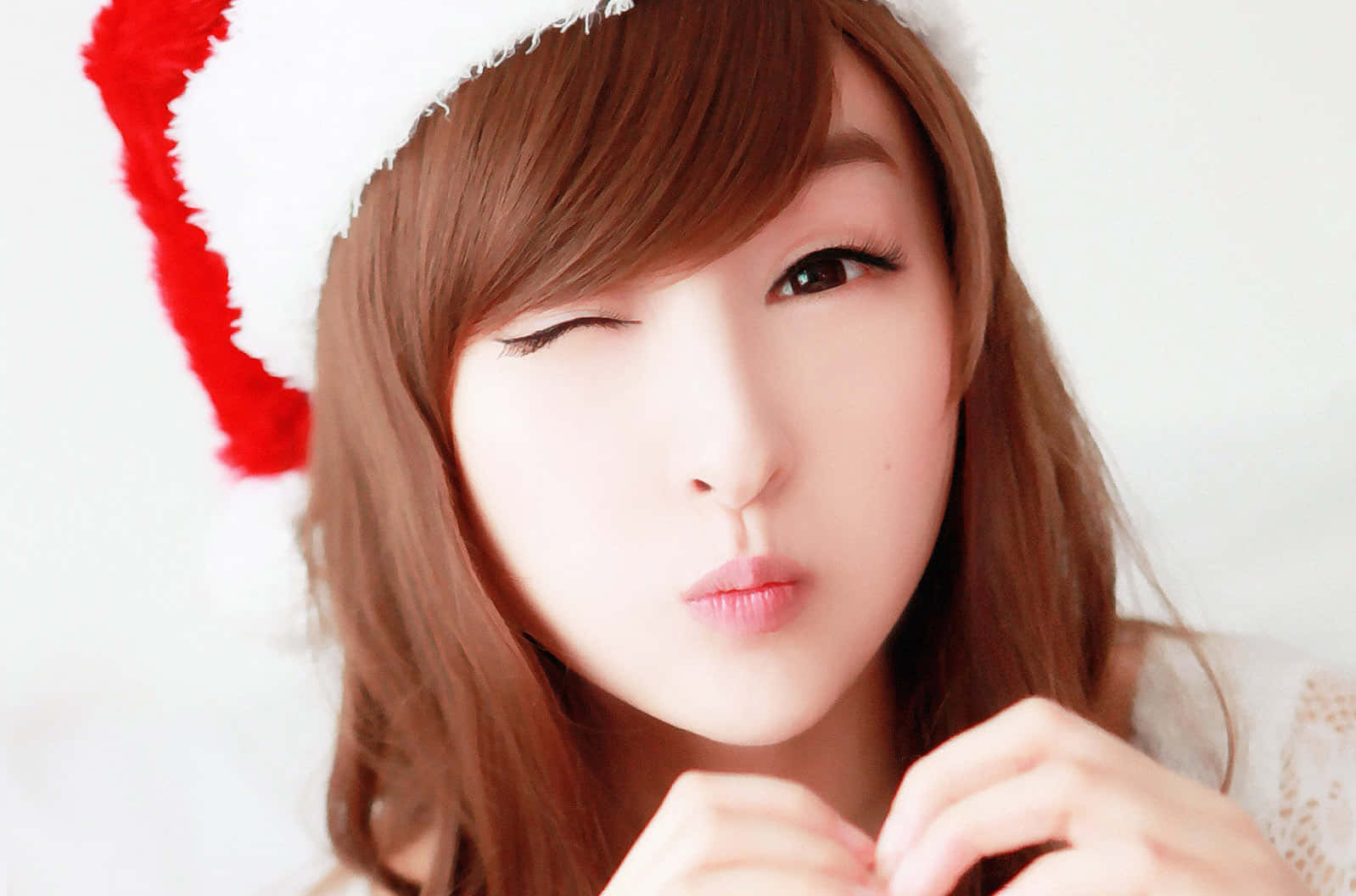 Cute Korean Girl Wearing A Santa Hat