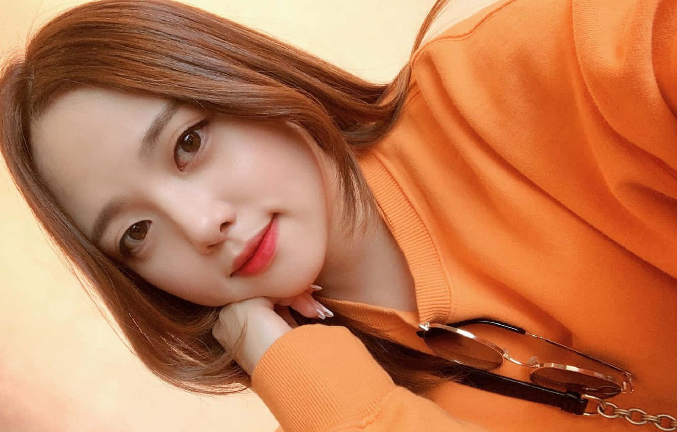 Cute Korean Girl Wearing An Orange Shirt
