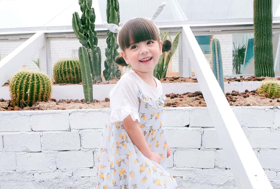 Cute Korean Toddler Wearing A White Dress