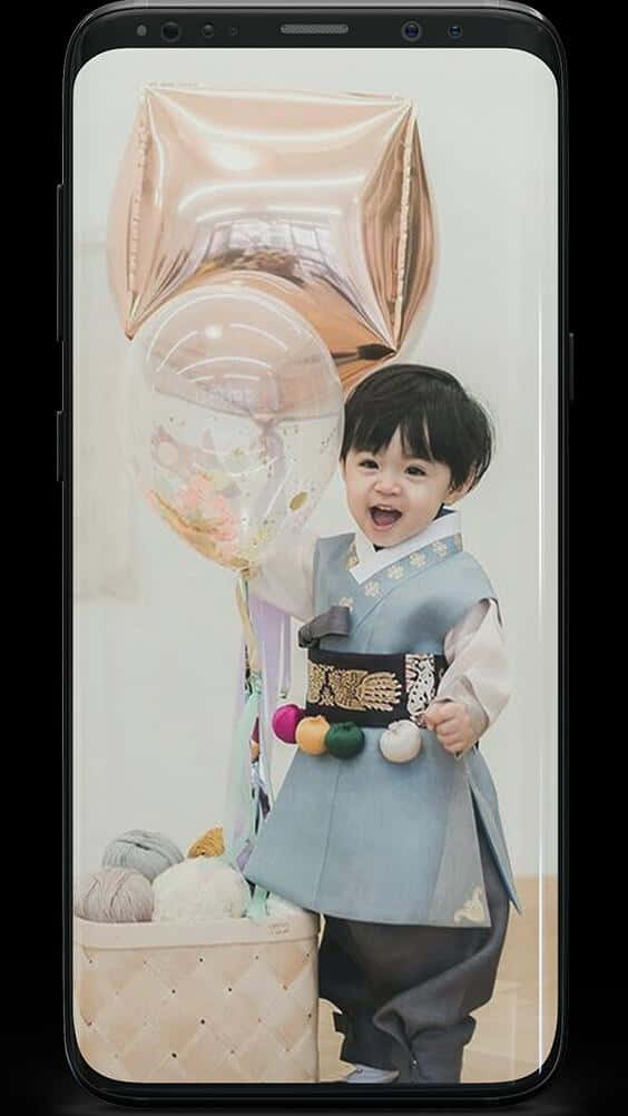 Cute Korean Toddler Wearing Traditional Korean Attire Background