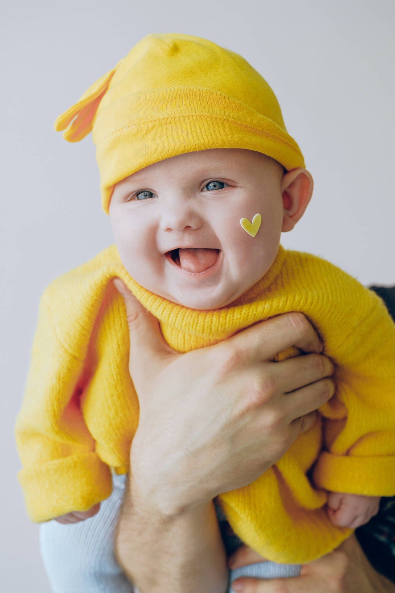 Cute Laughing Baby In Yellow