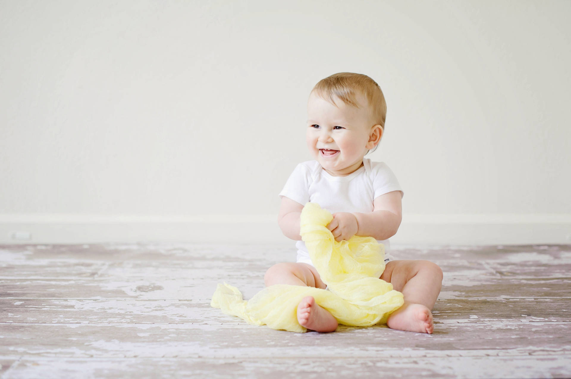 Cute Laughing Baby On The Floor