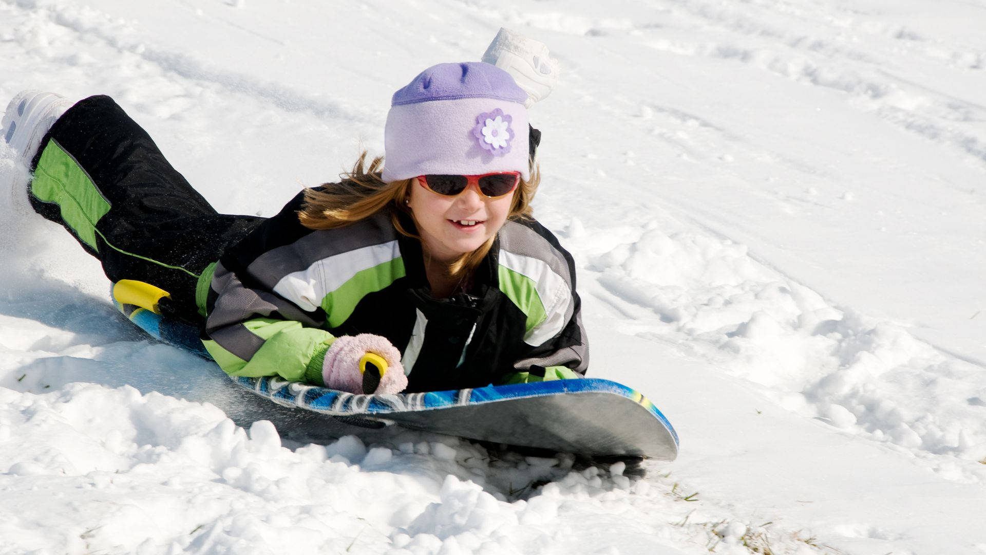 Cute Little Girl Sledding Background