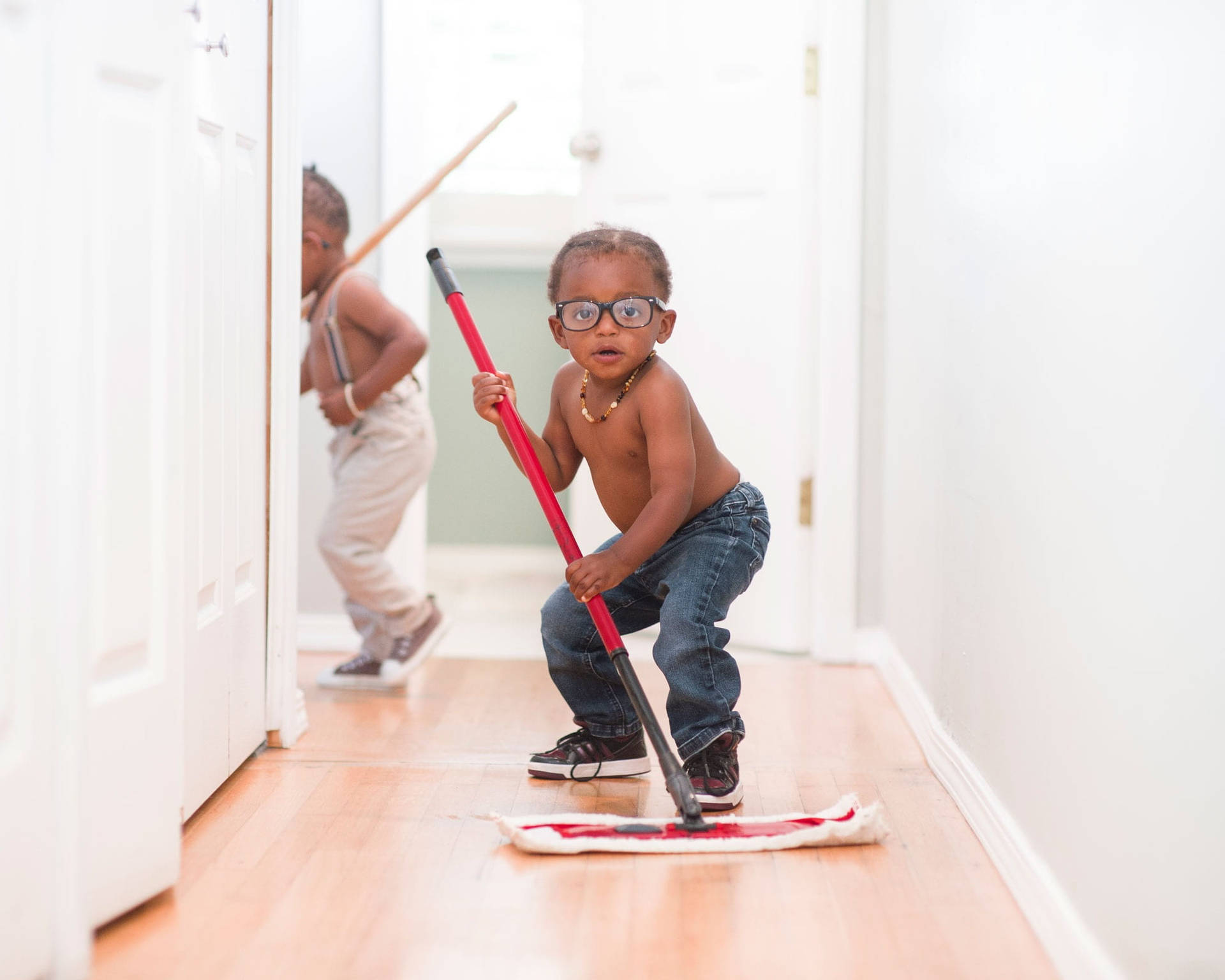 Cute Mopping Toddlers House Cleaning Background