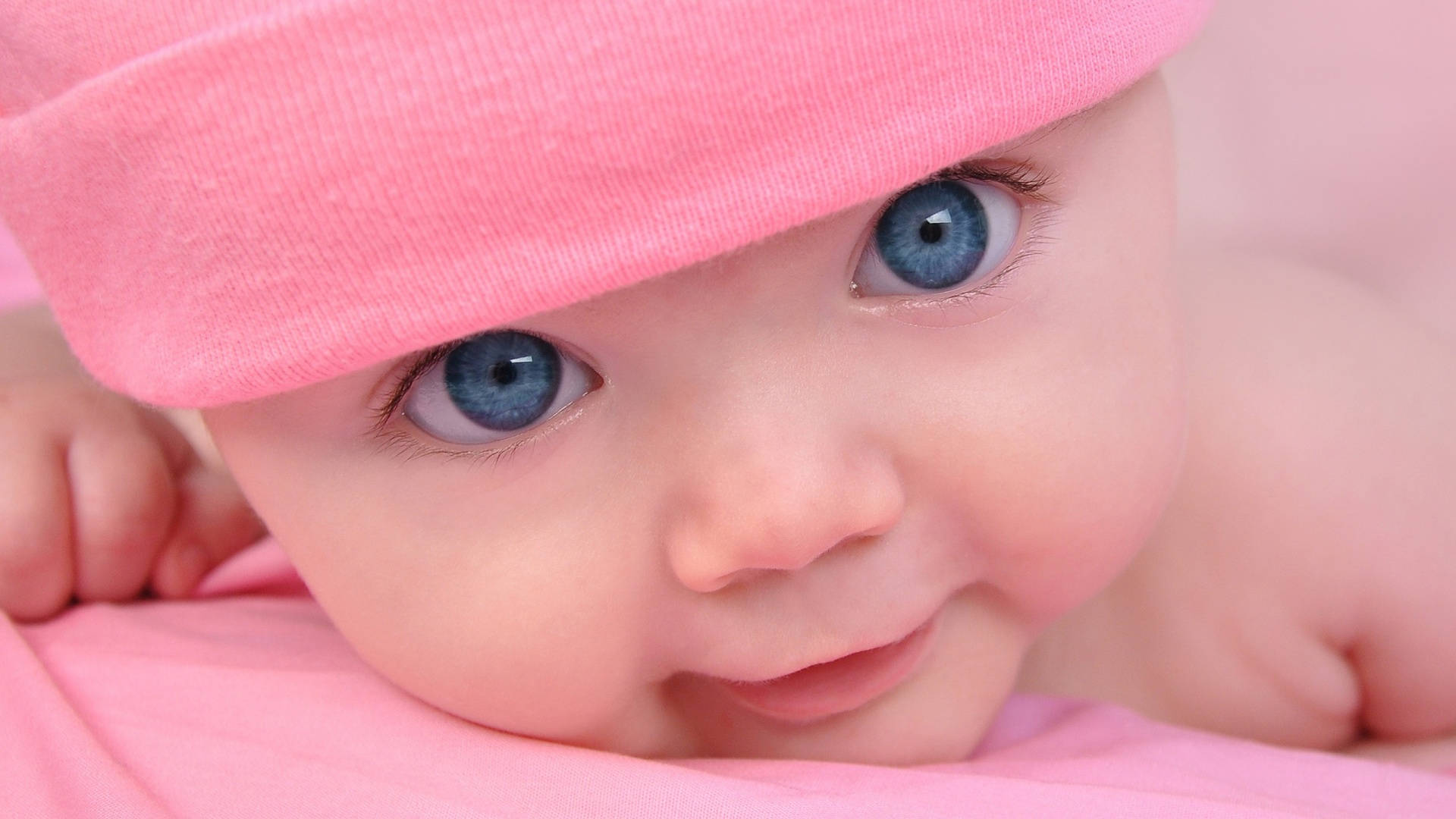 Cute Pink Baby Girl Blue Eyes Background
