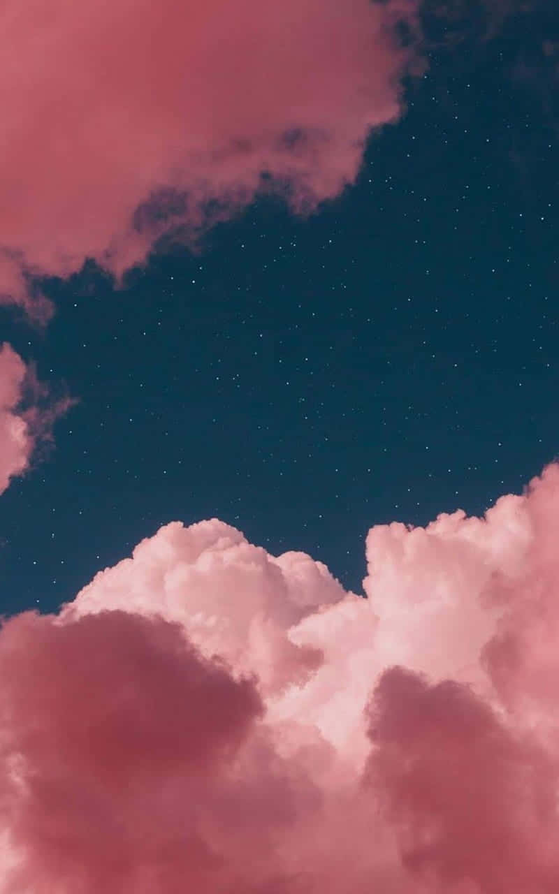 Cute Pink Clouds With A Green Sky Background
