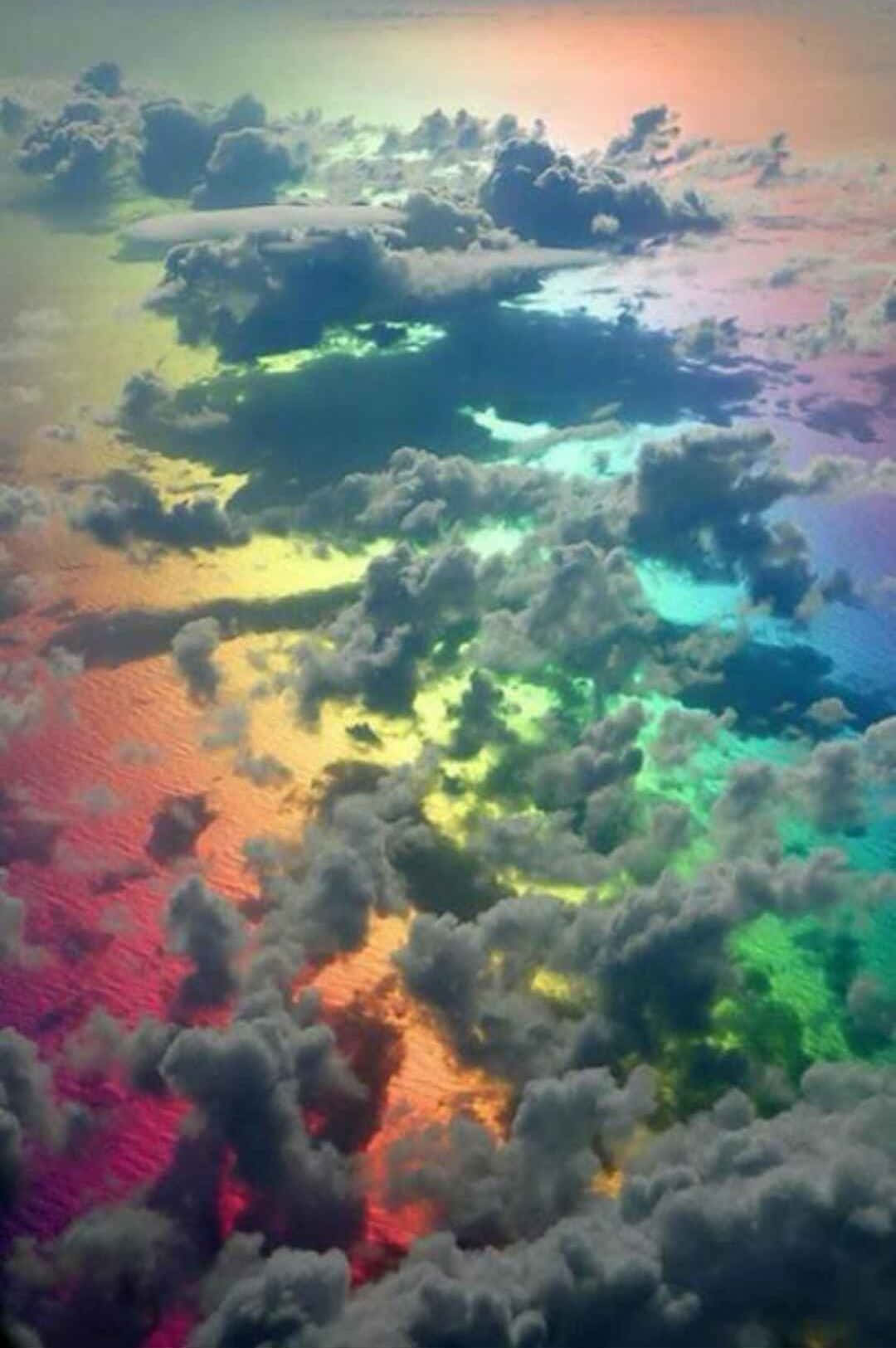 Cute Rainbow Behind Clouds Background