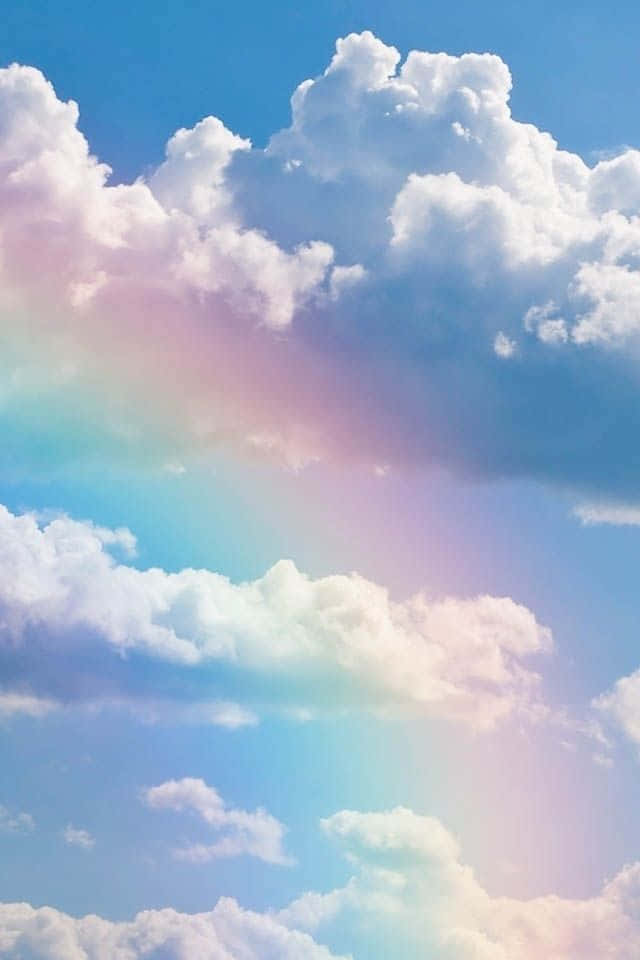 Cute Rainbow On Clouds Background