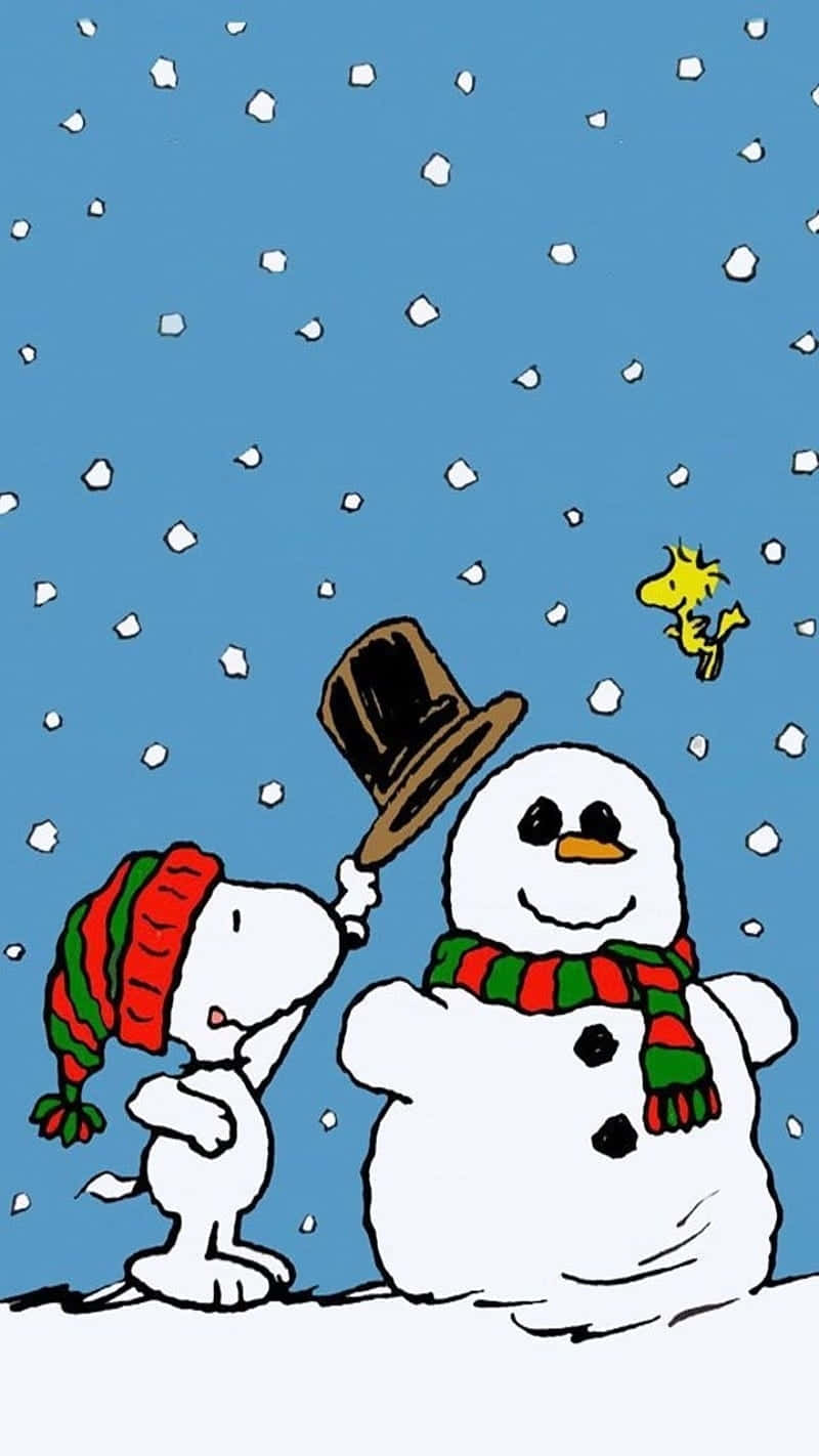 Cute Snoopy Christmas Putting Top Hat On Snowman Background