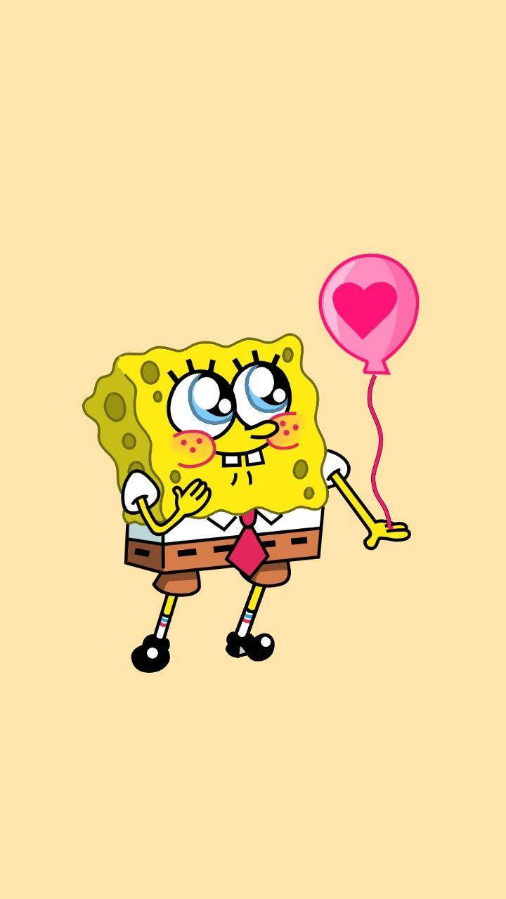 Cute Spongebob Squarepants Holding A Pink Balloon