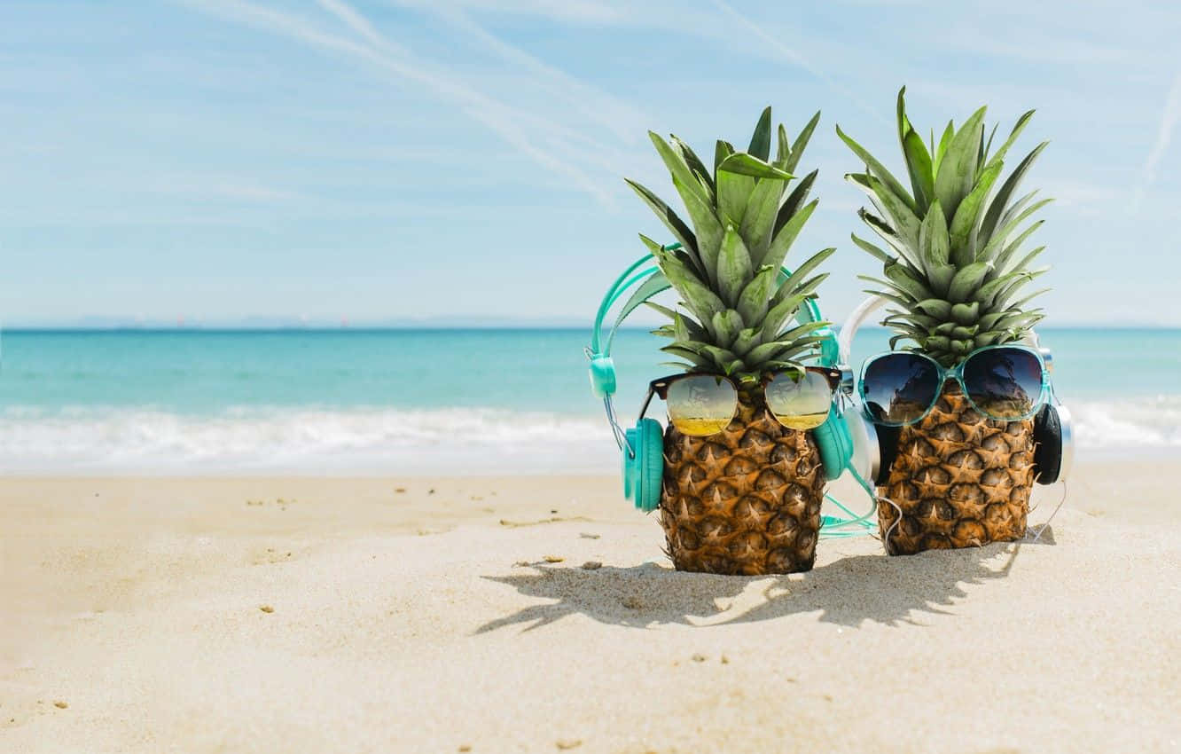 Cute Summer Beach Pineapples With Earphones Background