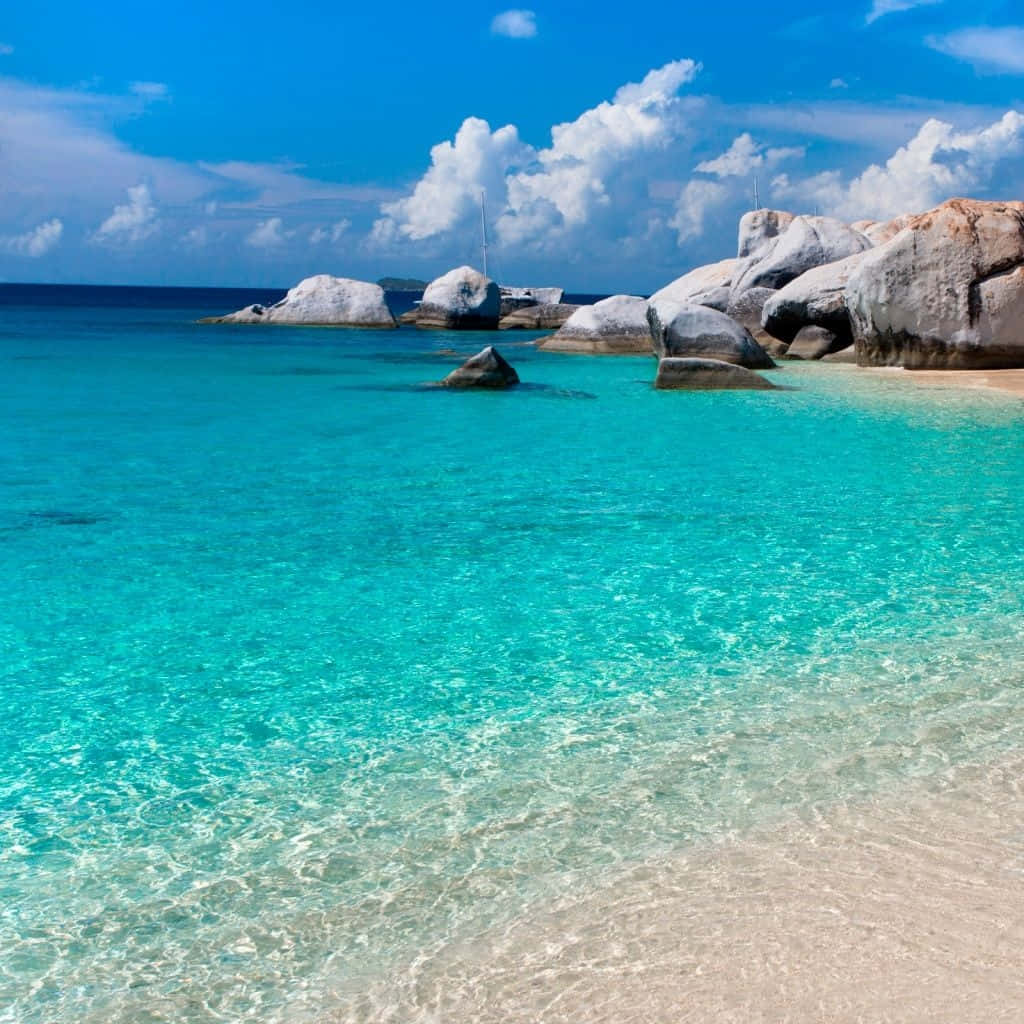 Cute Summer Beach With Large Rocks Background