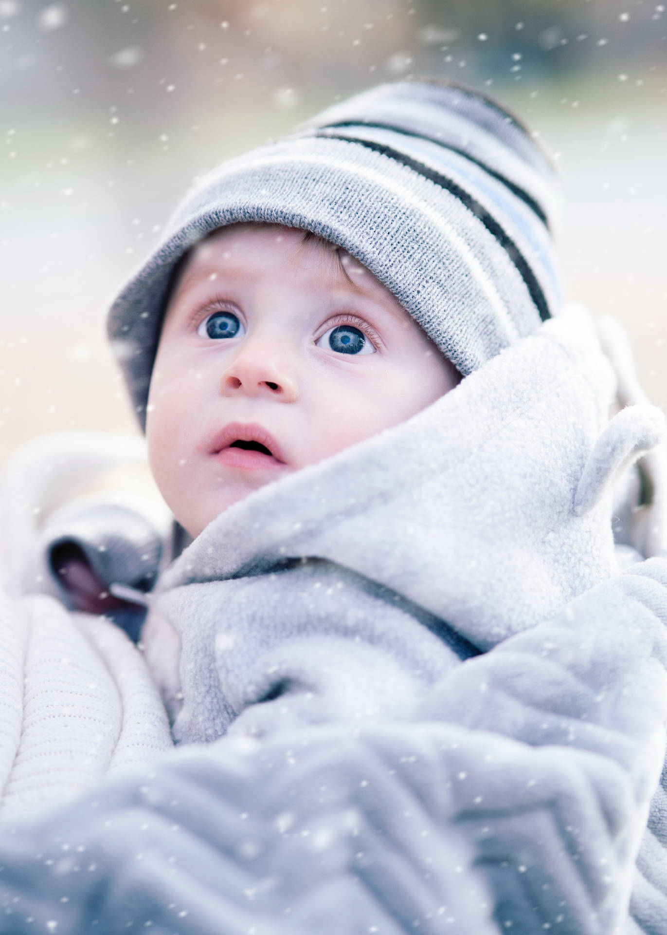 Cute Winter Baby Admiring Falling Snow