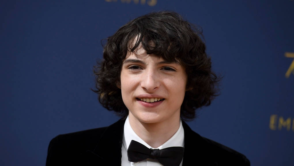 Cute Younger Finn Wolfhard Background