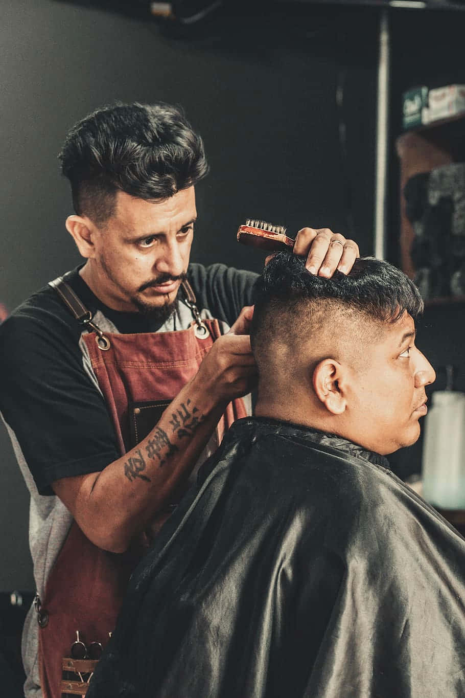 Cutting The Hair Of The Customer Background