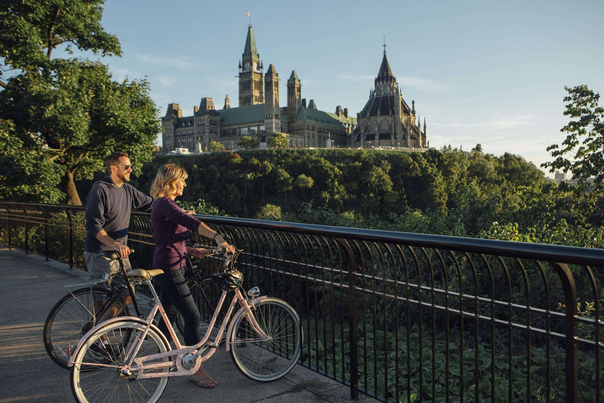 Cycling At The Rideau Canal In Ottawa Background