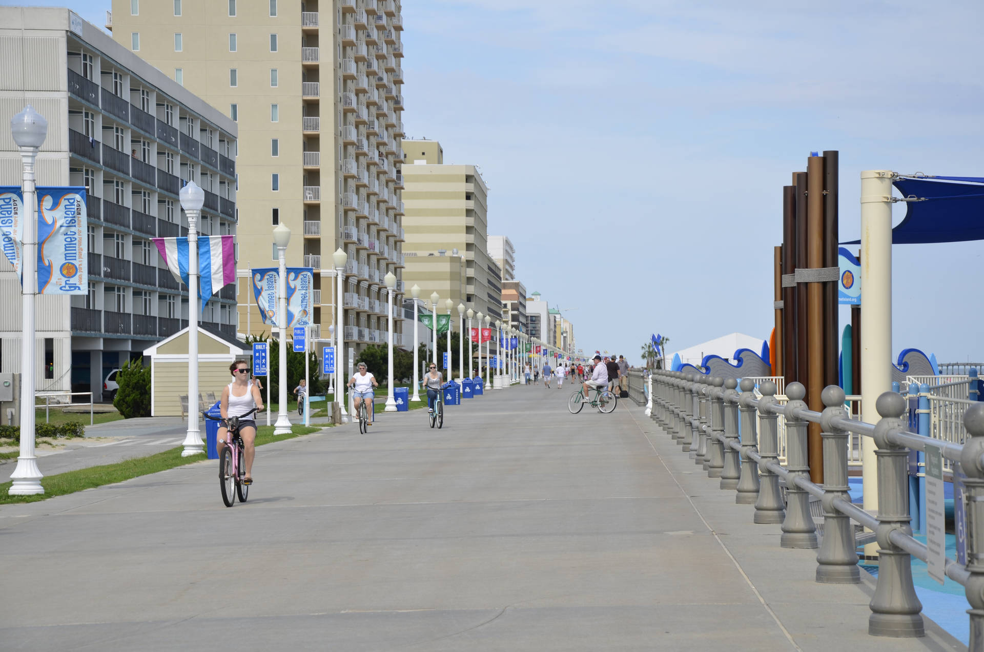 Cycling In Virginia Beach Boardwalk Near Chesapeake Background