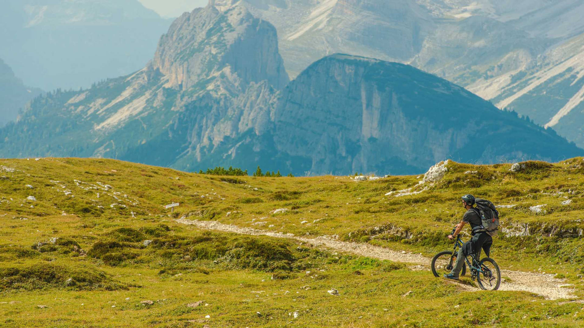 Cyclist Mountain Biking Mountain Trail Background