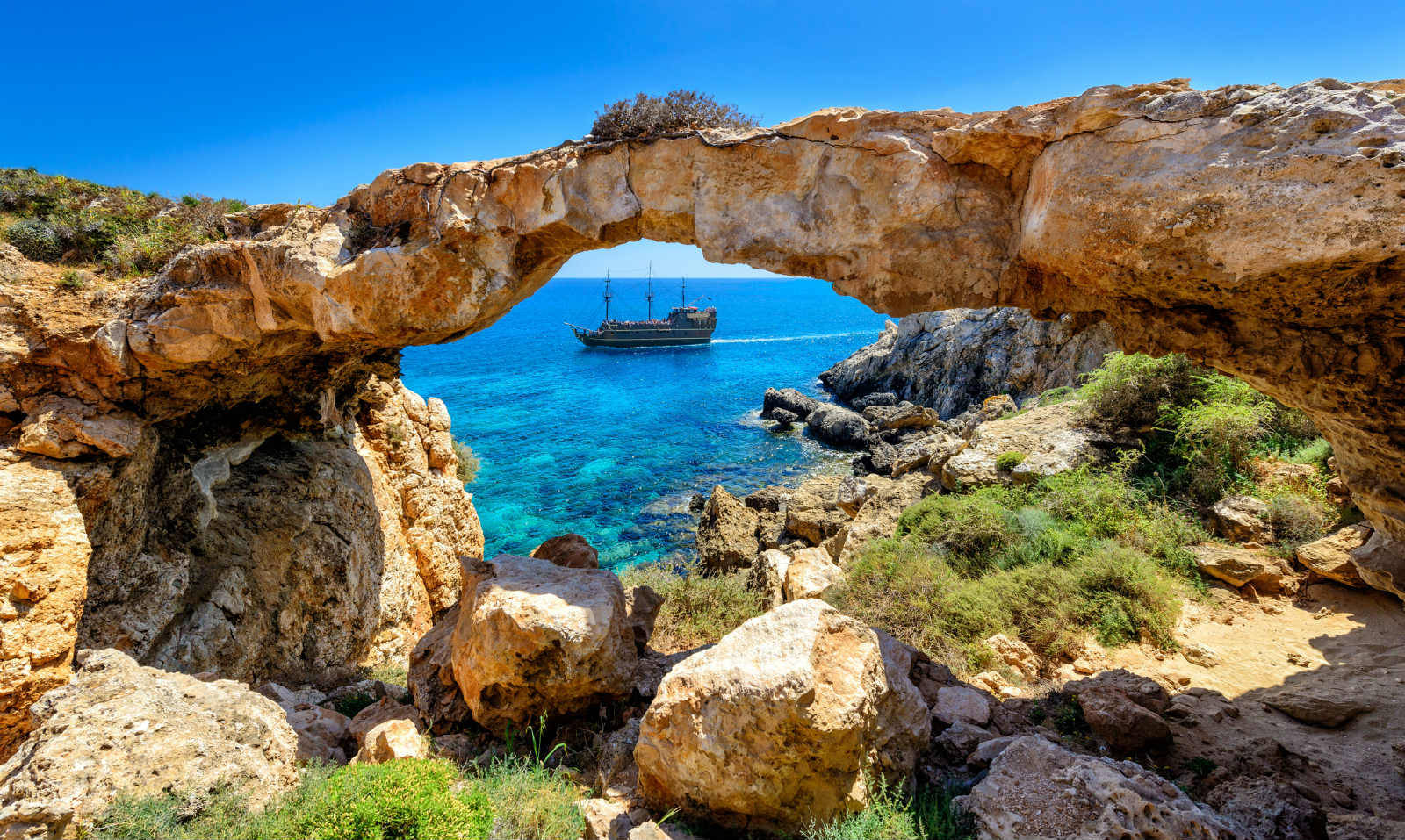 Cyprus Rock Bridge And Ship Background