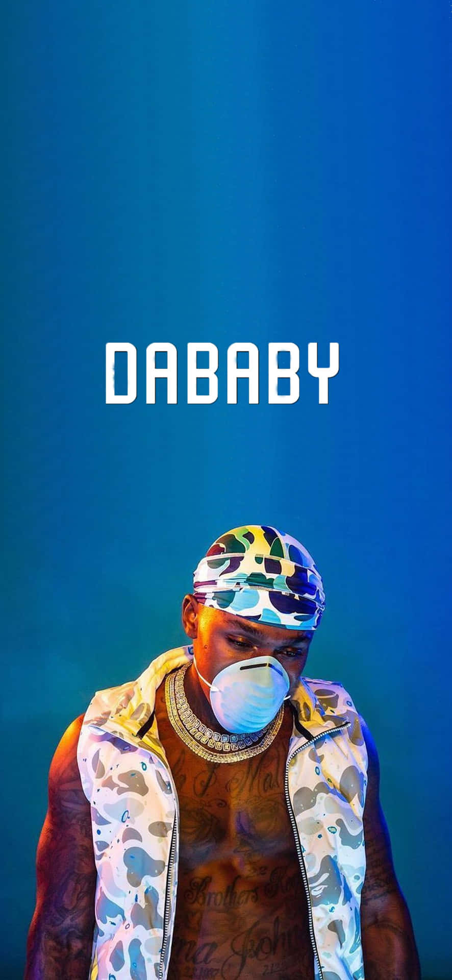 Dababy - A Man In Camouflage With A Bandana On His Head Background