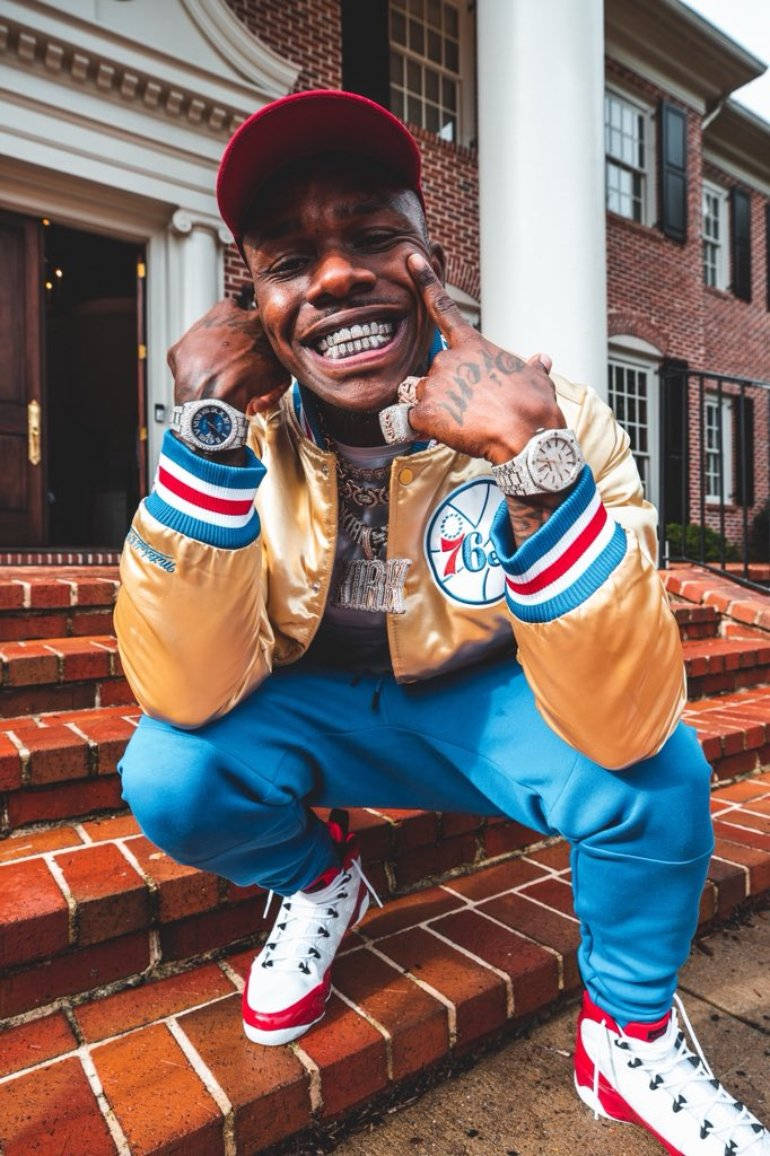 Dababy Phone Showing Off Luxury Watches Background