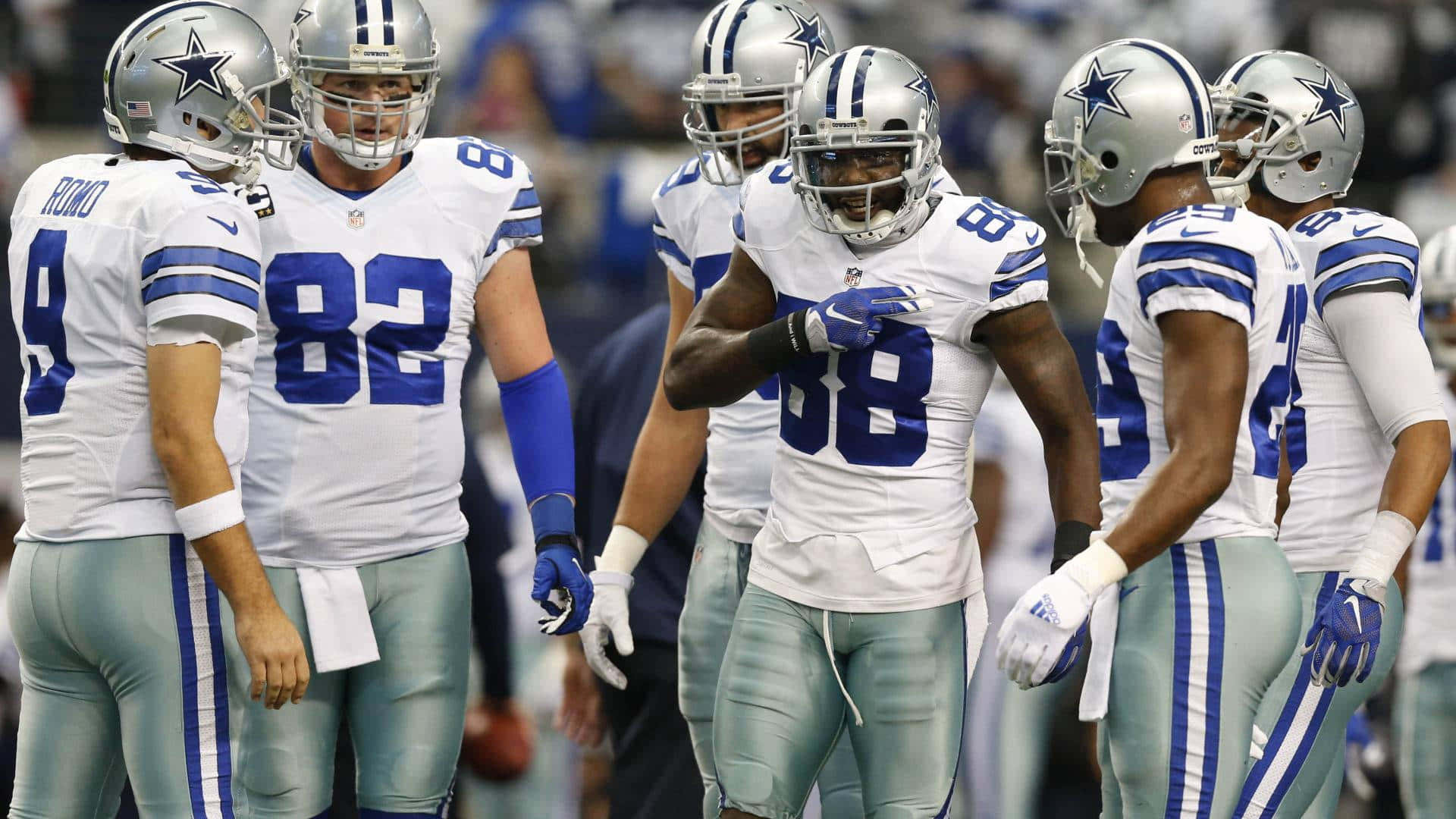 Dak Prescott, Ezekiel Elliott, And Amari Cooper Of The Dallas Cowboys Celebrate A Touchdown Background