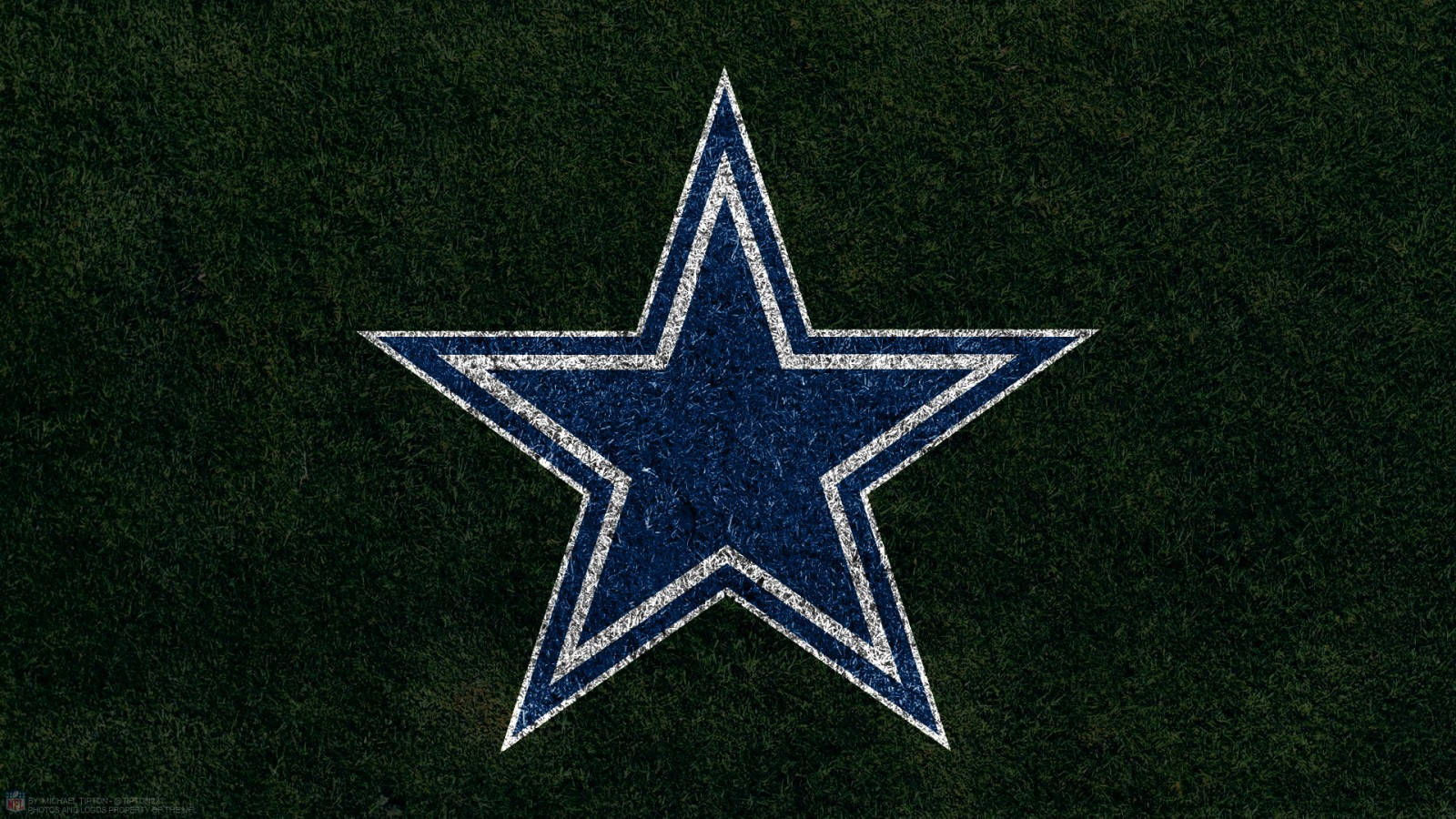 Dallas Cowboys Logo On Grass Background