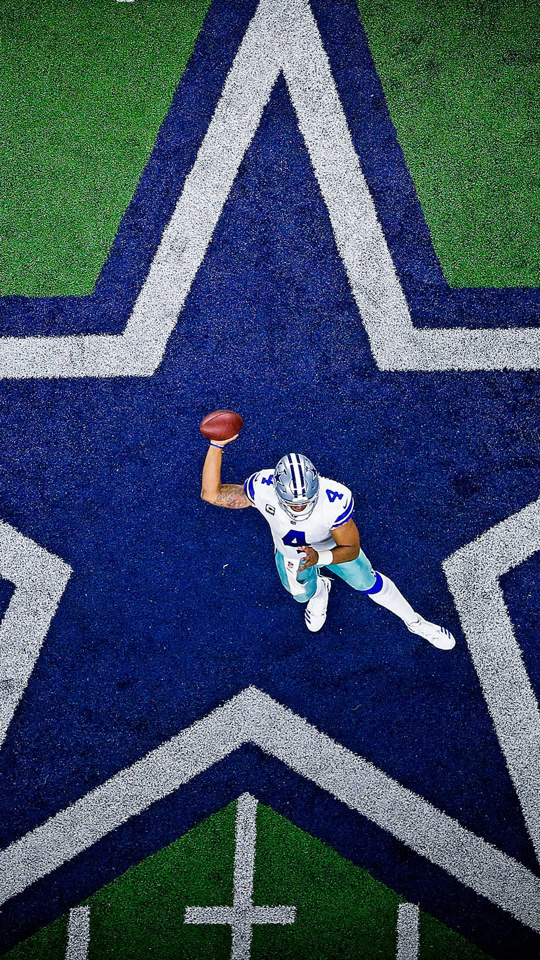 Dallas Cowboys Player Throwing A Ball Background
