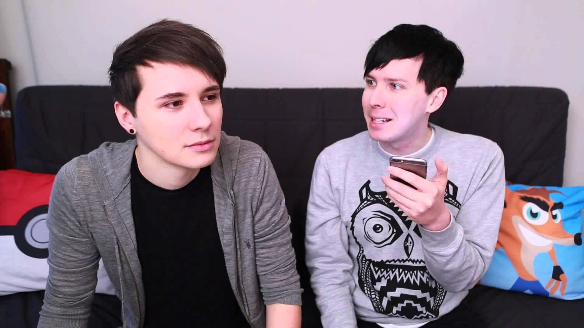 Dan And Phil Sitting On A Couch