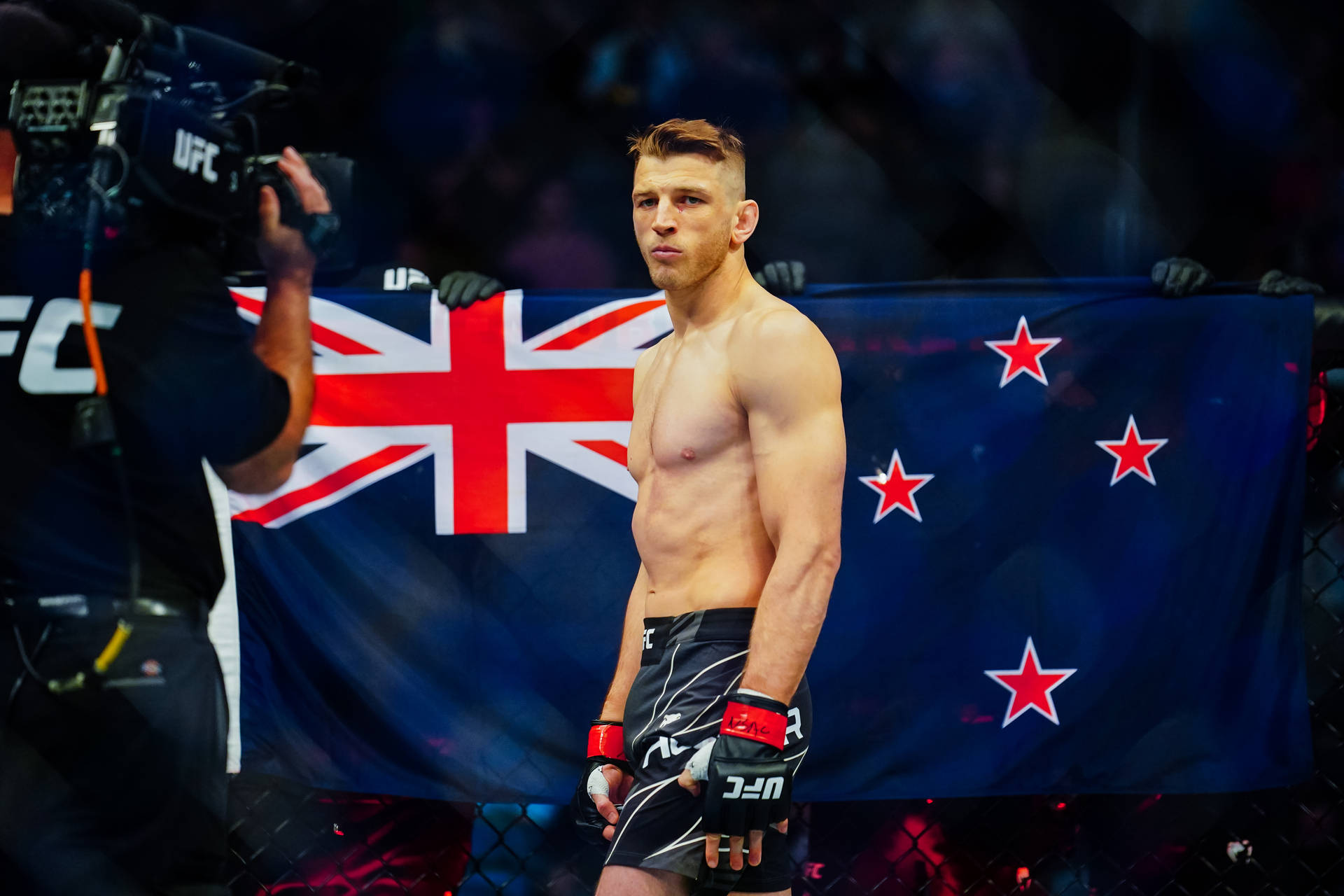 Dan Hooker Standing With Flag Background